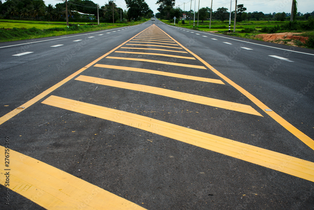 Obraz premium Road traffic paint Yellow on the asphalt surface