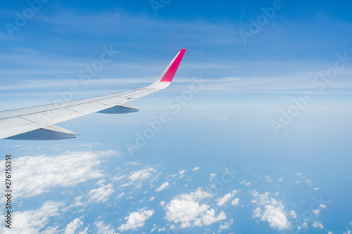 aircraft Wing on cloudscape and blue sky