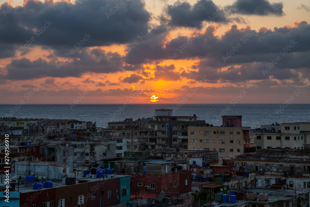 Aerial view of the residential neighborhood in the Havana City, Capital of Cuba, during a colorful sunset.