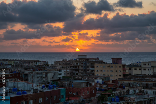 Aerial view of the residential neighborhood in the Havana City, Capital of Cuba, during a colorful sunset. © edb3_16