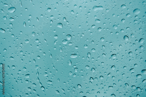 Rain drops on window. Autumn rain on the car glass, selective focus on raindrop.