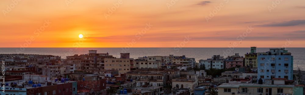 Aerial panoramic view of the residential neighborhood in the Havana City, Capital of Cuba, during a colorful sunset.