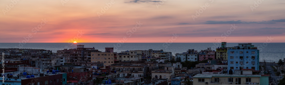 Aerial panoramic view of the residential neighborhood in the Havana City, Capital of Cuba, during a colorful sunset.