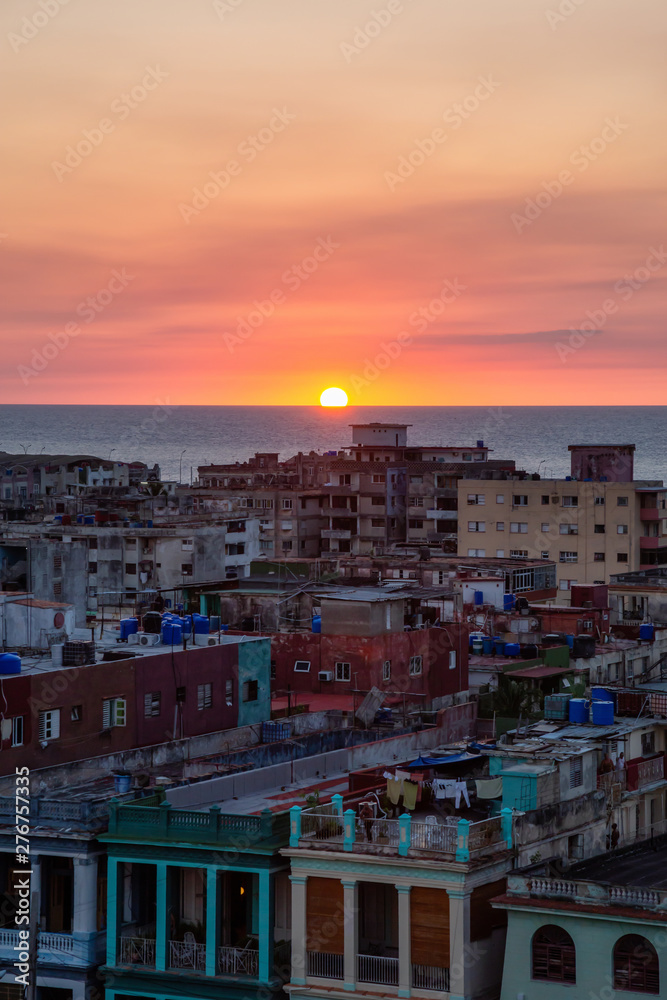 Fototapeta premium Aerial view of the residential neighborhood in the Havana City, Capital of Cuba, during a colorful sunset.