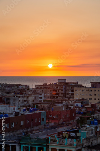 Aerial view of the residential neighborhood in the Havana City, Capital of Cuba, during a colorful sunset. © edb3_16