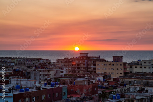Aerial view of the residential neighborhood in the Havana City, Capital of Cuba, during a colorful sunset. © edb3_16