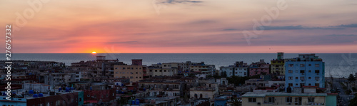 Aerial panoramic view of the residential neighborhood in the Havana City, Capital of Cuba, during a colorful sunset. © edb3_16