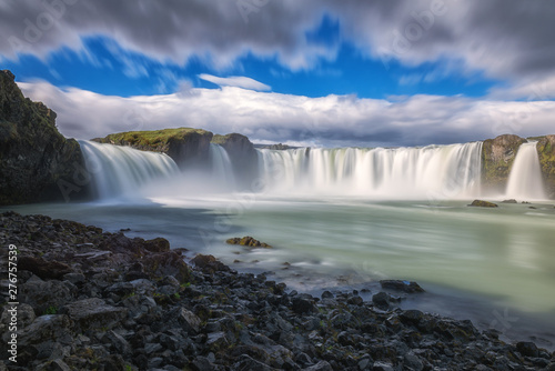 Godafoss  Akureyri  waterfall at sunny day  spectacular landscape of Iceland iconic place with blue cloudy sky  long exposure. Skjalfandafljot river  Nor  urland  North of Iceland