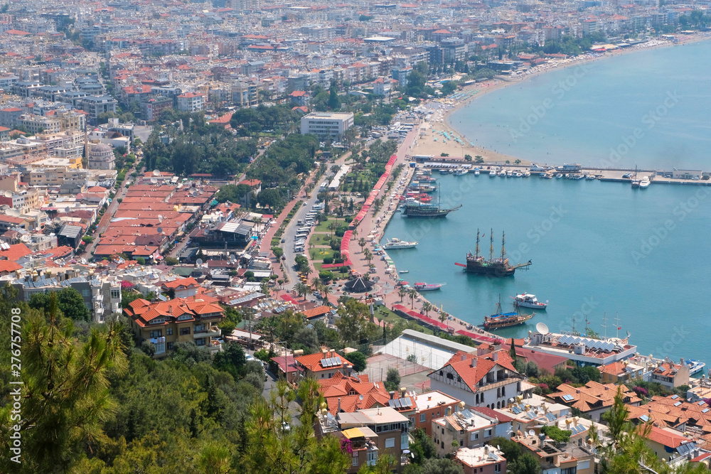 Fototapeta premium View of the fortress, the ruins on the Peninsula of Alanya, Turkey, Asia.Mediterranean sea, beautiful background. Famous tourist destination with high mountains. Part of an ancient Old castle.