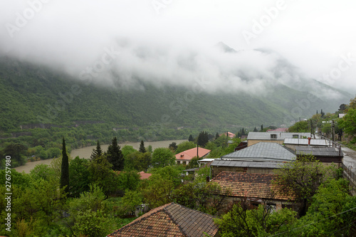 View to streets of Mtskheta and Kura river on foggy rainy morning. Ancient capital of Georgia © mors74