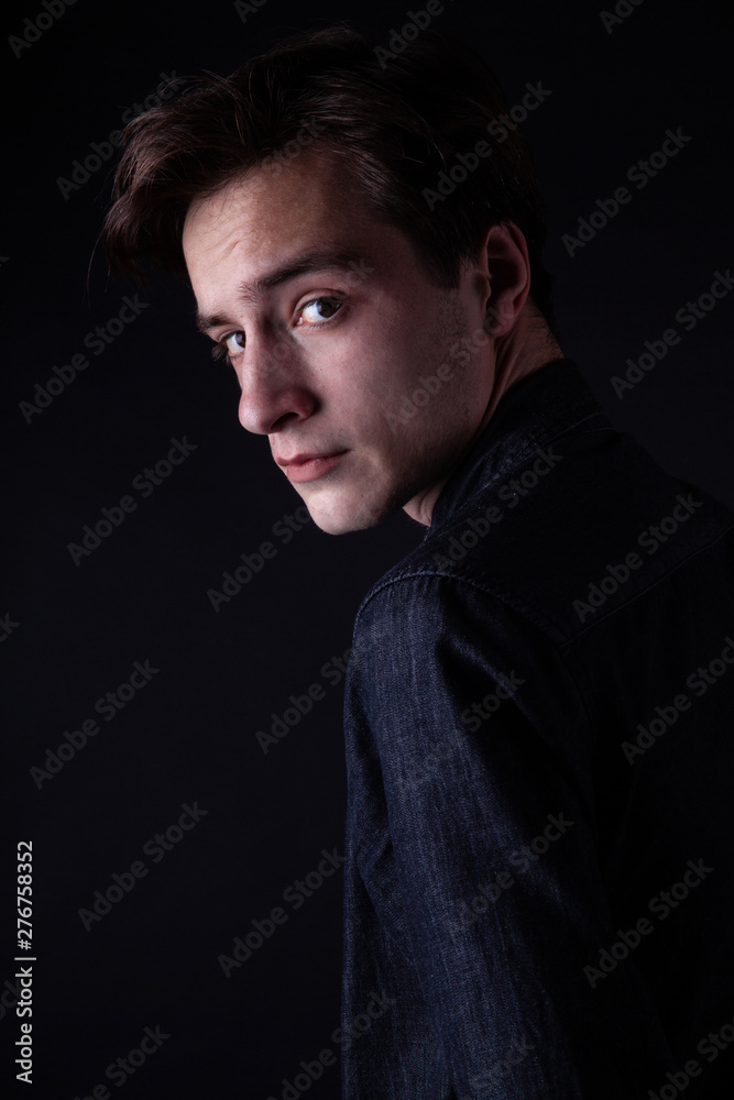 Fototapeta premium Young caucasian adult posing in the studio