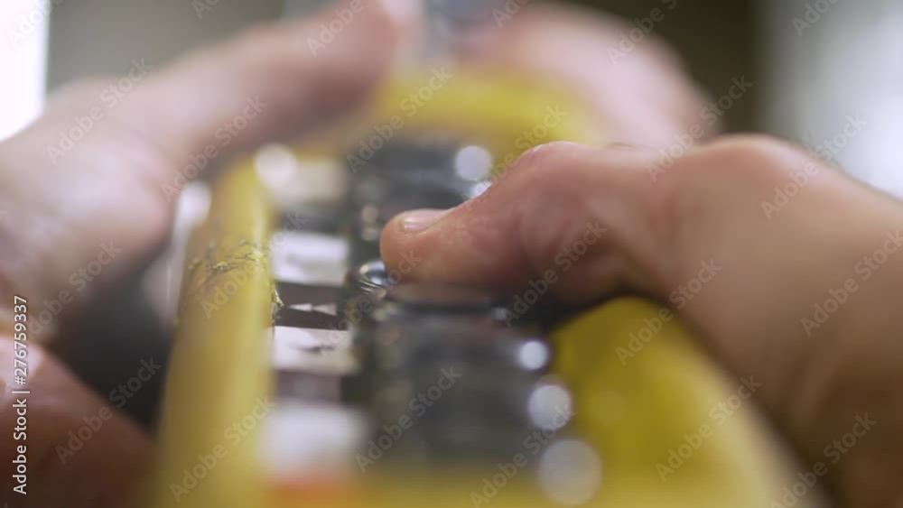 Worker's hands on factory switcher with buttons. Worker's hands on factory switcher with buttons.
