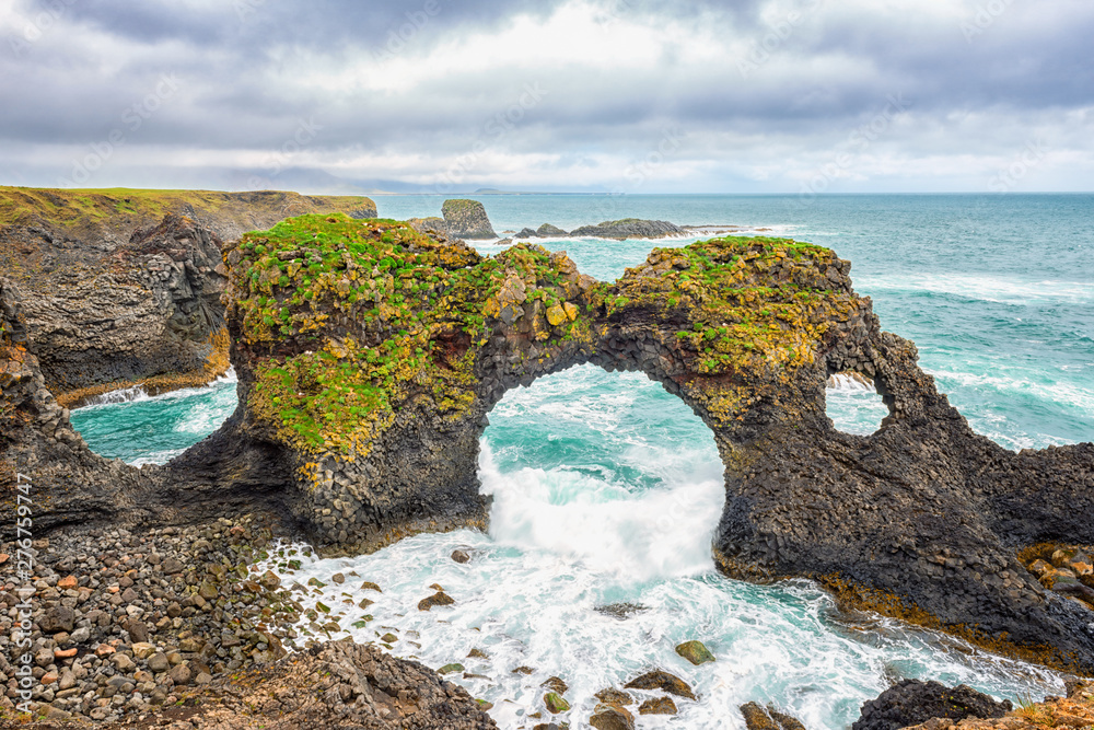 Amazing seascape, Gatklettur basalt rock arch at the volcanic cliff,  Atlantic coast of Arnarstapi in the west of Iceland, natural travel  background. Arnarstapi, Snaefellsnes peninsula, Iceland, Europe Photos |  Adobe Stock