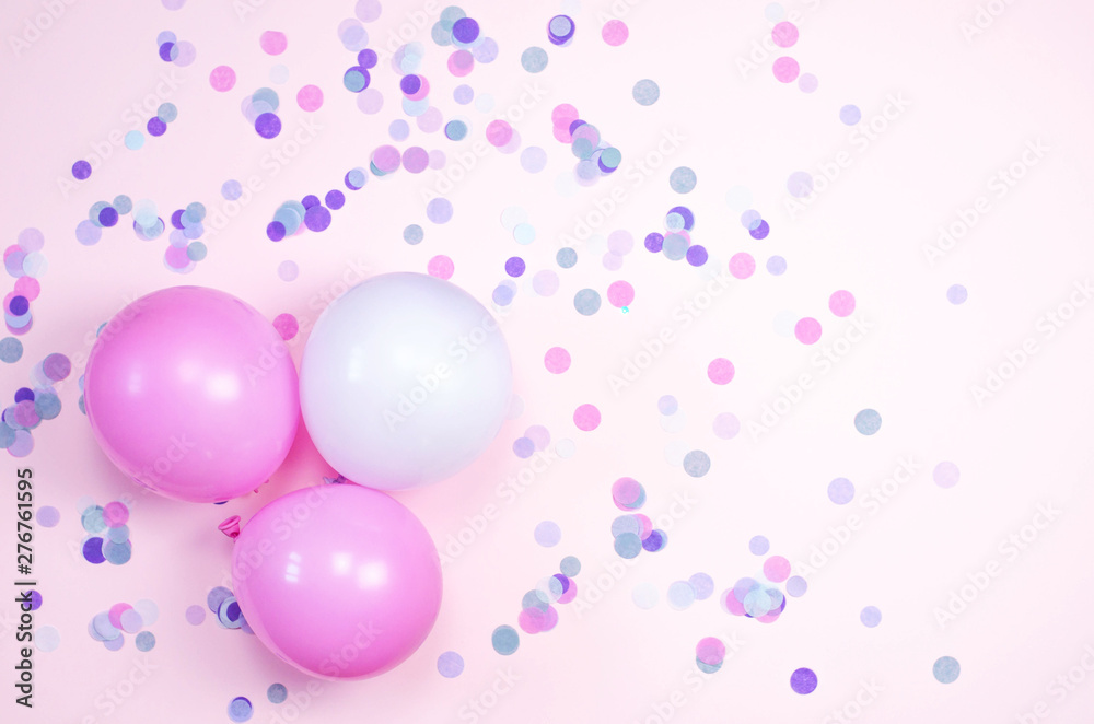 Bright background with small confetti and balloons.