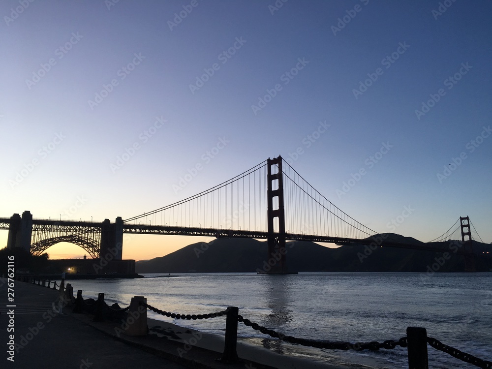 Golden Gate Bridge romantic sunset with blue sky
