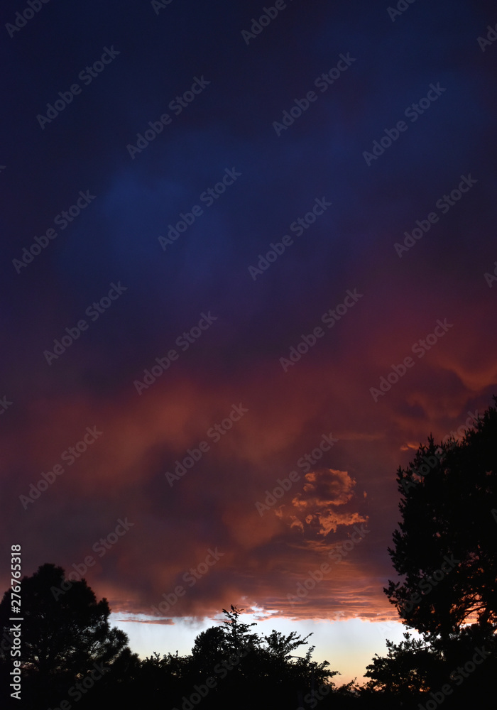 Dark pinks and blue clouds in the sky high-quality photograph for magazines, blogs, posters, flyers, wall art, cards, business cards, branding, articles, and newspapers. Dark pinks and blue clouds in the sky high-quality photograph for magazines, blogs, posters, flyers, wall art, cards, business cards, branding, articles, and newspapers.