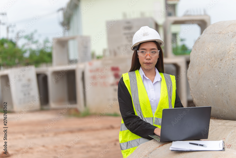 Asian engineer working at site of a large building project,Thailand people,Work overtime at construction site