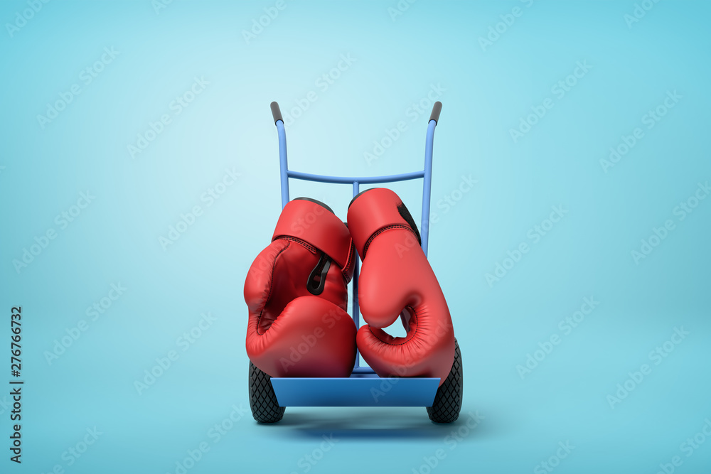 Φωτογραφία 3d rendering of pair of big red boxing gloves on blue hand truck standing in half-turn on light-blue background with copy space