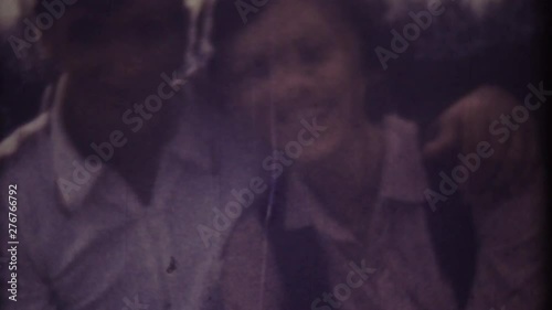 Family chronicle, memories: Happy young loving couple. My love parents. My beauty family. Shot on 8 mm retro camera.