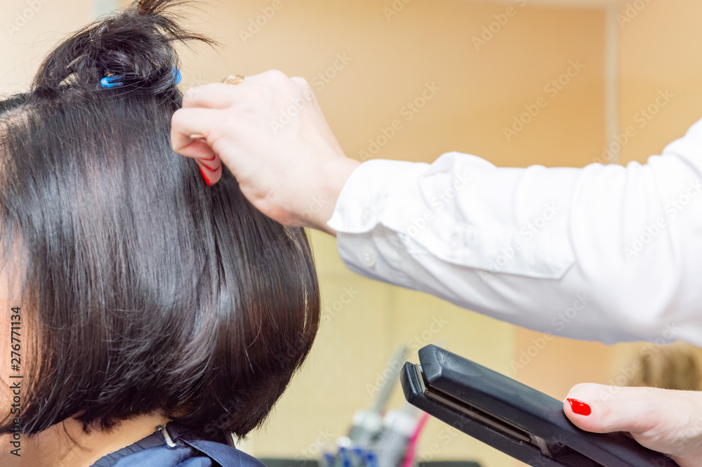 Fototapeta premium hairdresser working with scissors, white-haired woman