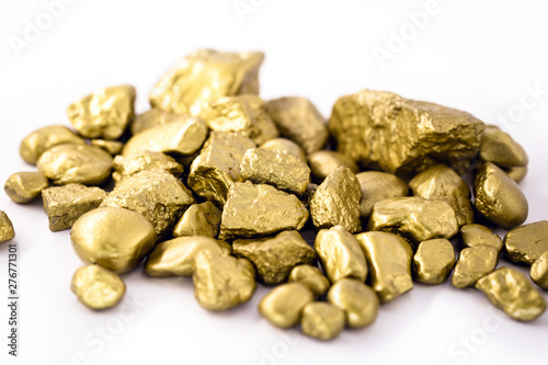 gold nuggets on white background isolated. High resolution photo of gold stones. Concept of luxury and wealth.