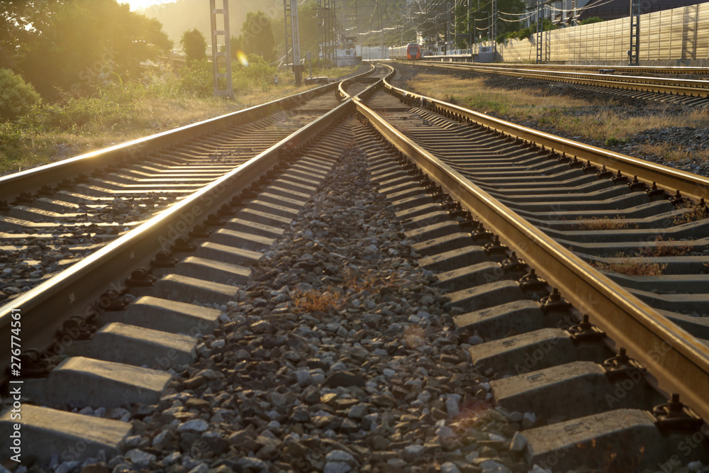 railroad going into the distance into the golden sunset railroad going into the distance into the golden sunset