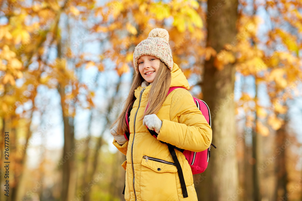school, education and season concept - happy student girl with schoolbag at autumn park school, education and season concept - happy student girl with schoolbag at autumn park