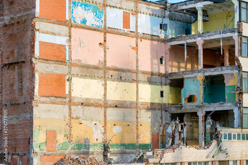 Partially destroyed industrial building with colored walls © eshma
