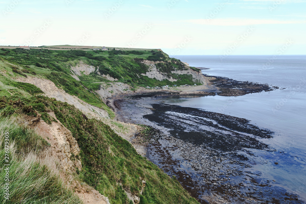 Port Mulgrave bay and jetty, North Yorkshire, UK.  Viewed from the Cleveland Way walk from Runswick Bay to Staithes.