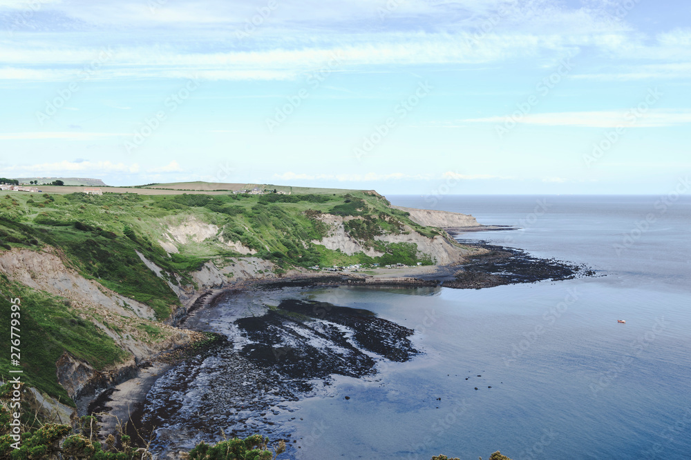 Port Mulgrave bay and jetty, North Yorkshire, UK.  Viewed from the Cleveland Way walk from Runswick Bay to Staithes.