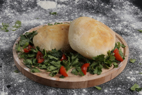 Bread with salad and tomato.