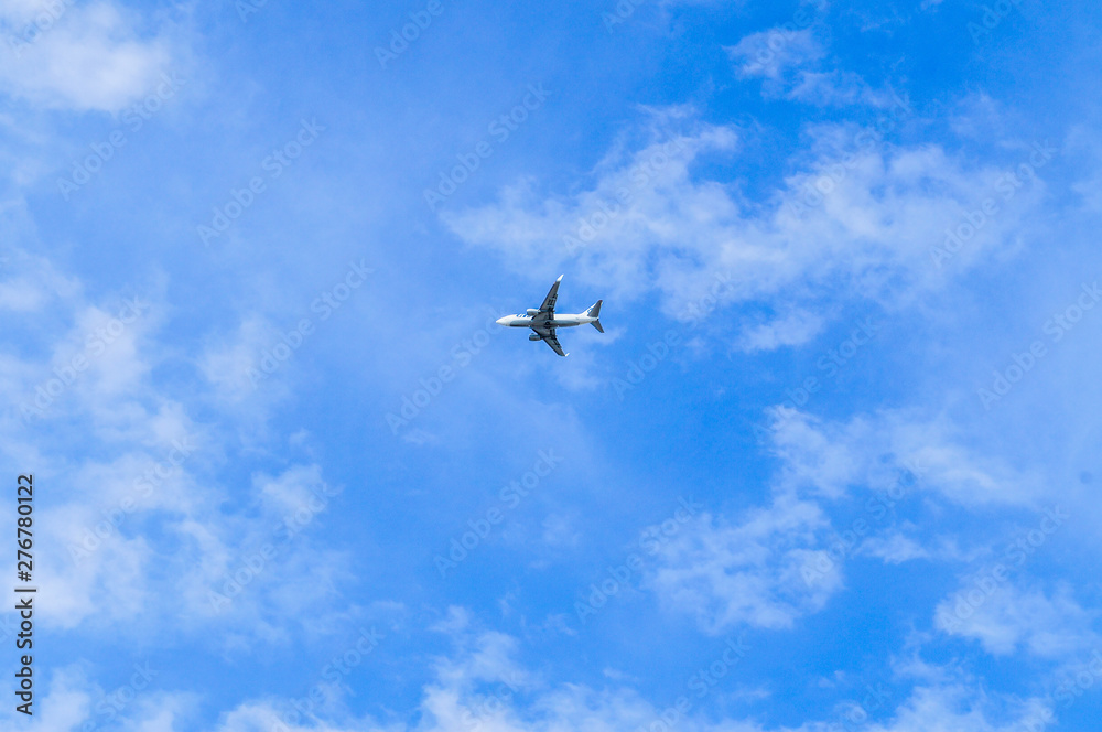 plane in the blue sky