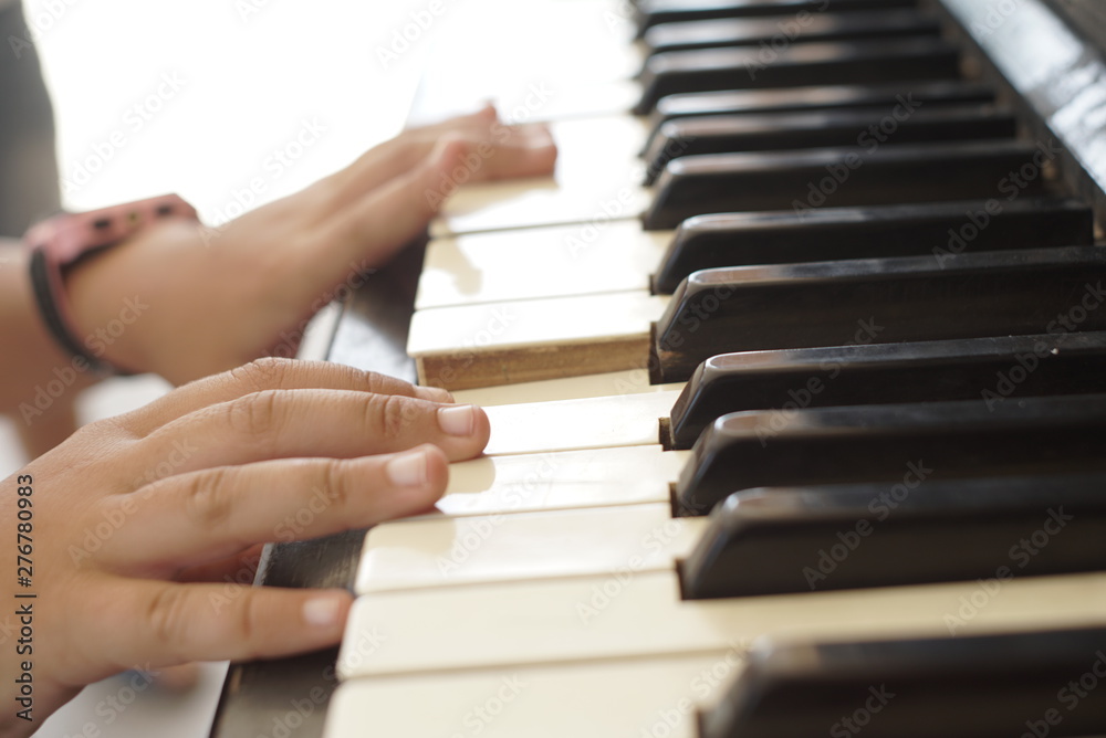 child hands play the old piano child hands play the old piano