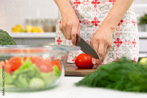 Woman preparing delicious and healthy food in the home kitchen. Healthy diet concept