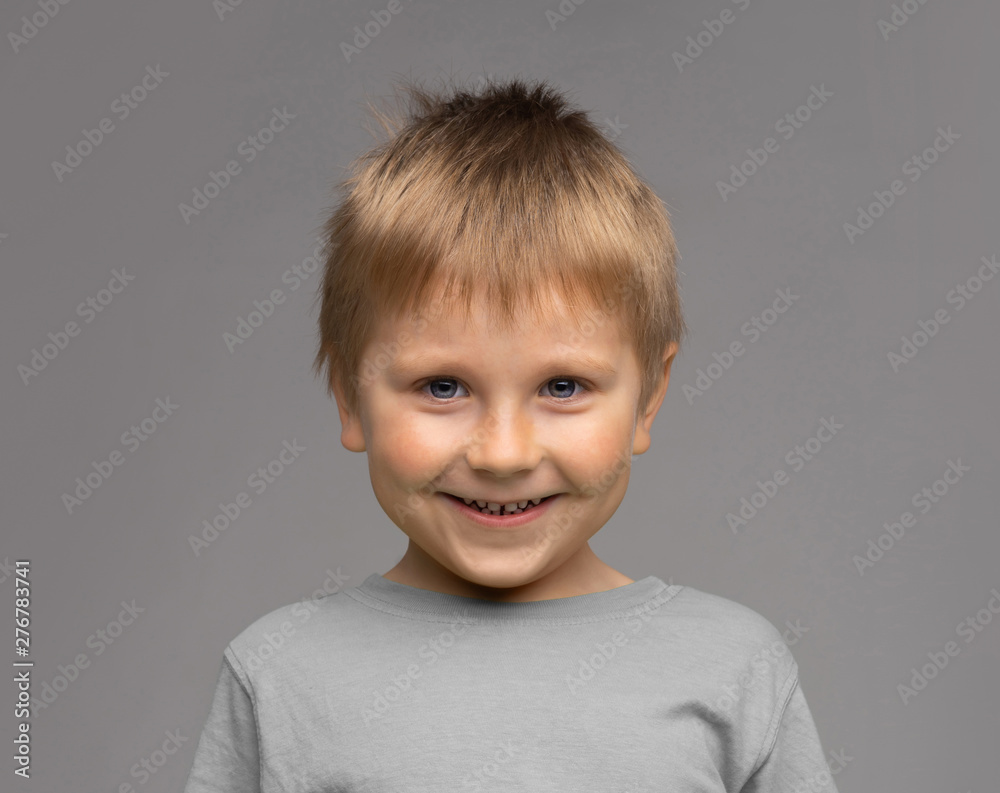 Portrait of happy smiling boy. Attractive kid in studio. Portrait of happy smiling boy. Attractive kid in studio.
