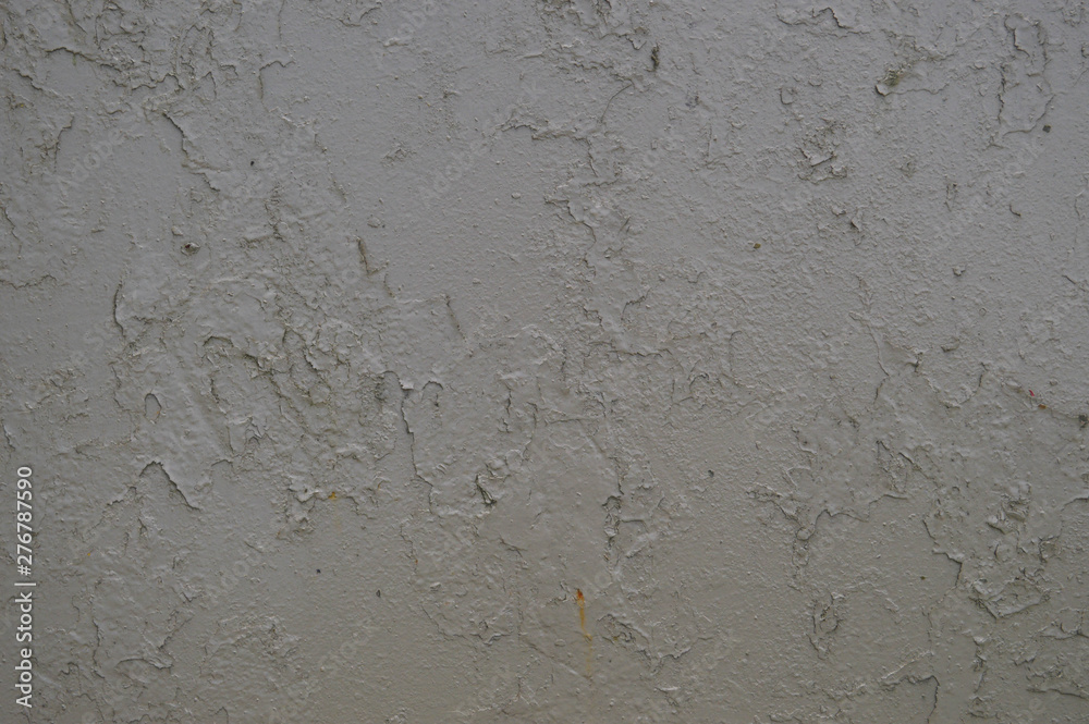 Texture of iron metal painted gray peeling paint of old battered scratched cracked ancient rusty metal sheet wall with corrosion. The background Texture of iron metal painted gray peeling paint of old battered scratched cracked ancient rusty metal sheet wall with corrosion. The background