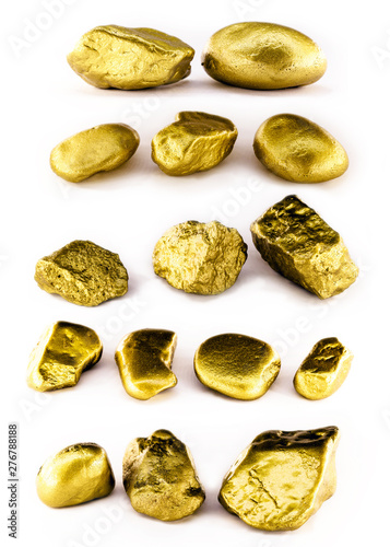 Collection of gold nuggets on isolated white background. High resolution photo of gold stones. Concept of luxury and wealth.
