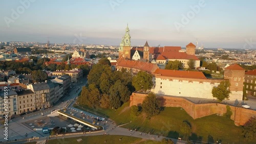 Wallpaper Mural Aerial view of Royal Wawel Cathedral and castle in Krakow, Poland, with Vistula river, park, yard and tourists at sunset. Old city in the background Torontodigital.ca
