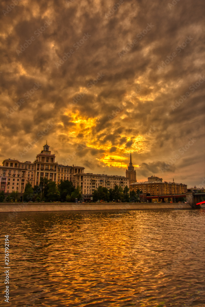 Vibrant sunset cityscape. Moscow river landscape with dramatic skies.