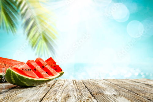 Watermelon on desk and free space for your decoration. 