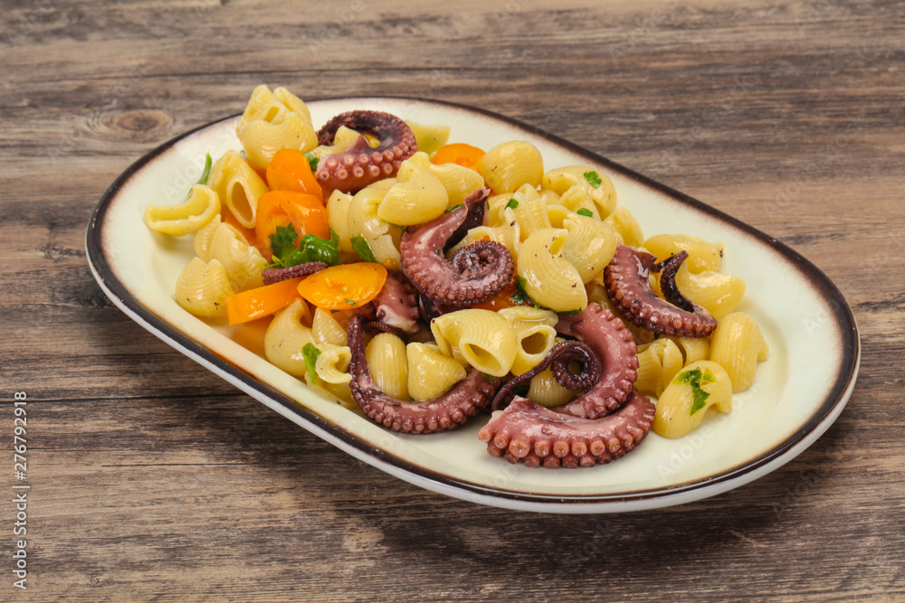 Pasta with octopus and yellow tomatoes - obrazy, fototapety, plakaty 