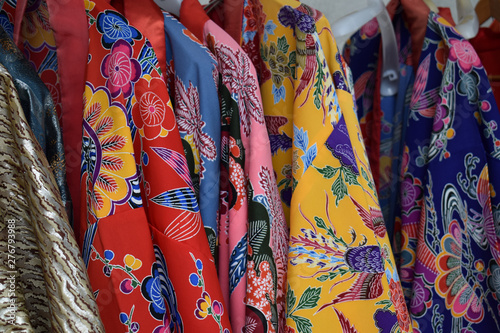 Traditional colorful red, pink, blue and yellow Kimonos from Okinawa Japan