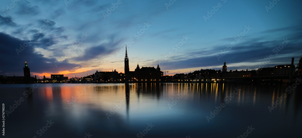 Stockholm, panoramic view over the old town and city hall at sunset