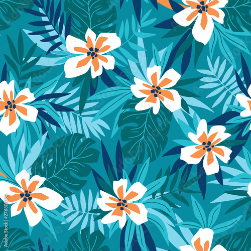 Hawaiian seamless pattern with pink flowers and blue tropical leaves. Stylish floral endless print for summer fabric design. Vector illustration.