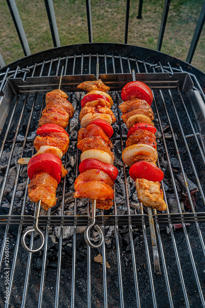Grilled delicious shashlik with tomato and onion in outdoor at home balcony, summer time