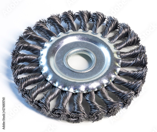 Metal brush for angle grinder on white background.
