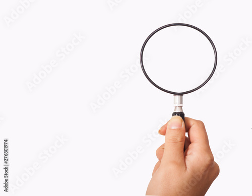 magnifying glass holding hand for research