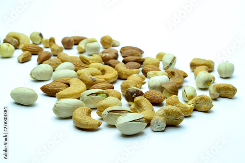 nuts almonds cashew hazelnuts scattered on white background