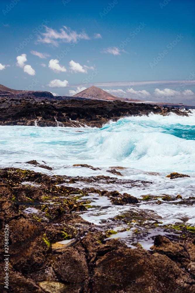 Fototapeta premium Beautiful view of the coastline of Gran Canaria, rocky shore, atlantic waves, turquise water. 