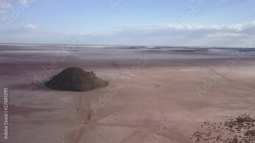 Aerial view of the lake ballard. The lonely hill in front of the lake rises from the flat sand landscape on which the Menzies Gormley statue stand photo